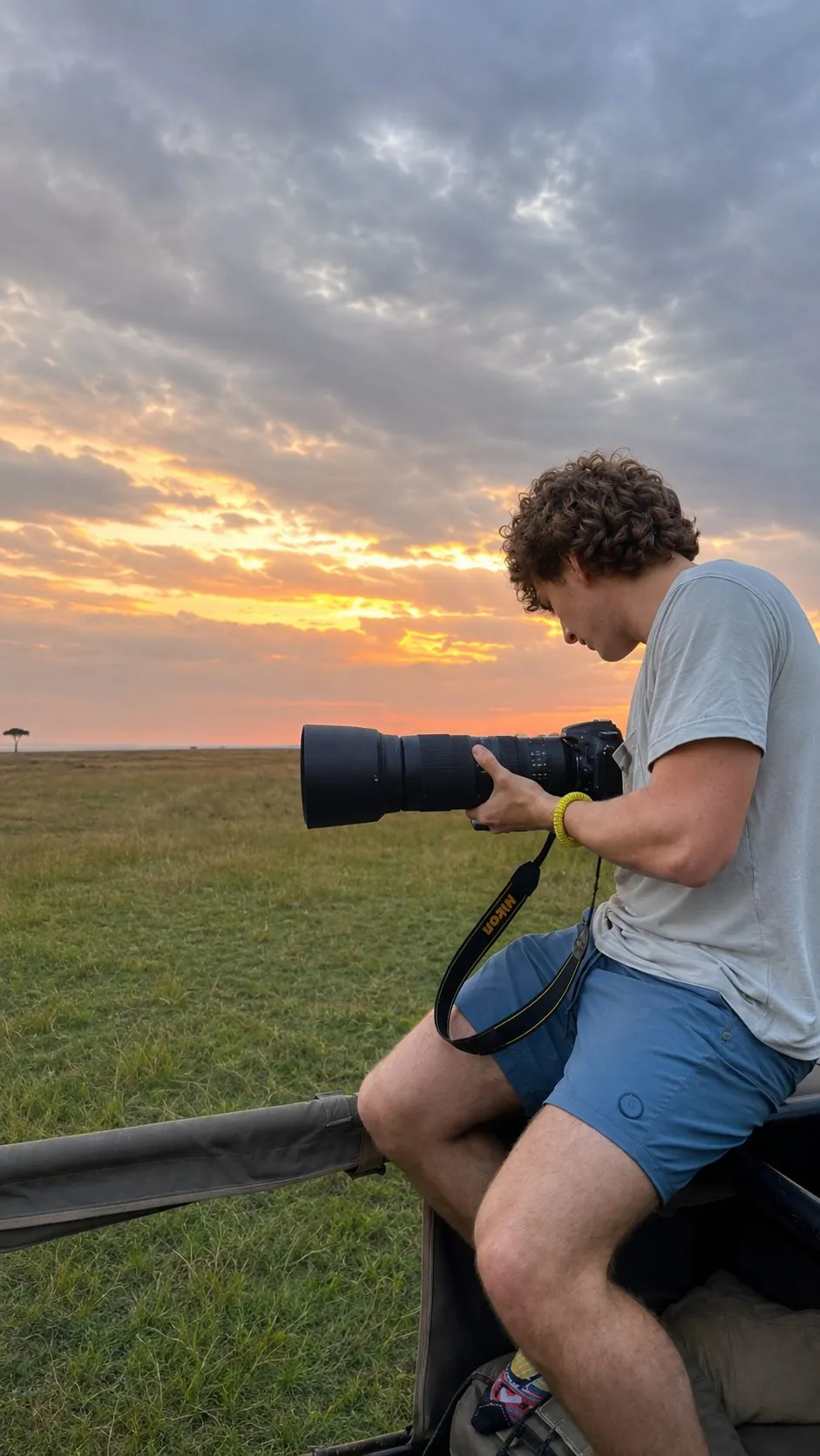 Luke watching the sunrise on a trip abroad