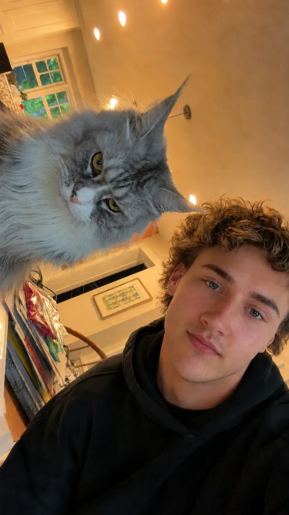 Luke at home on the North Shore with his cat Willow